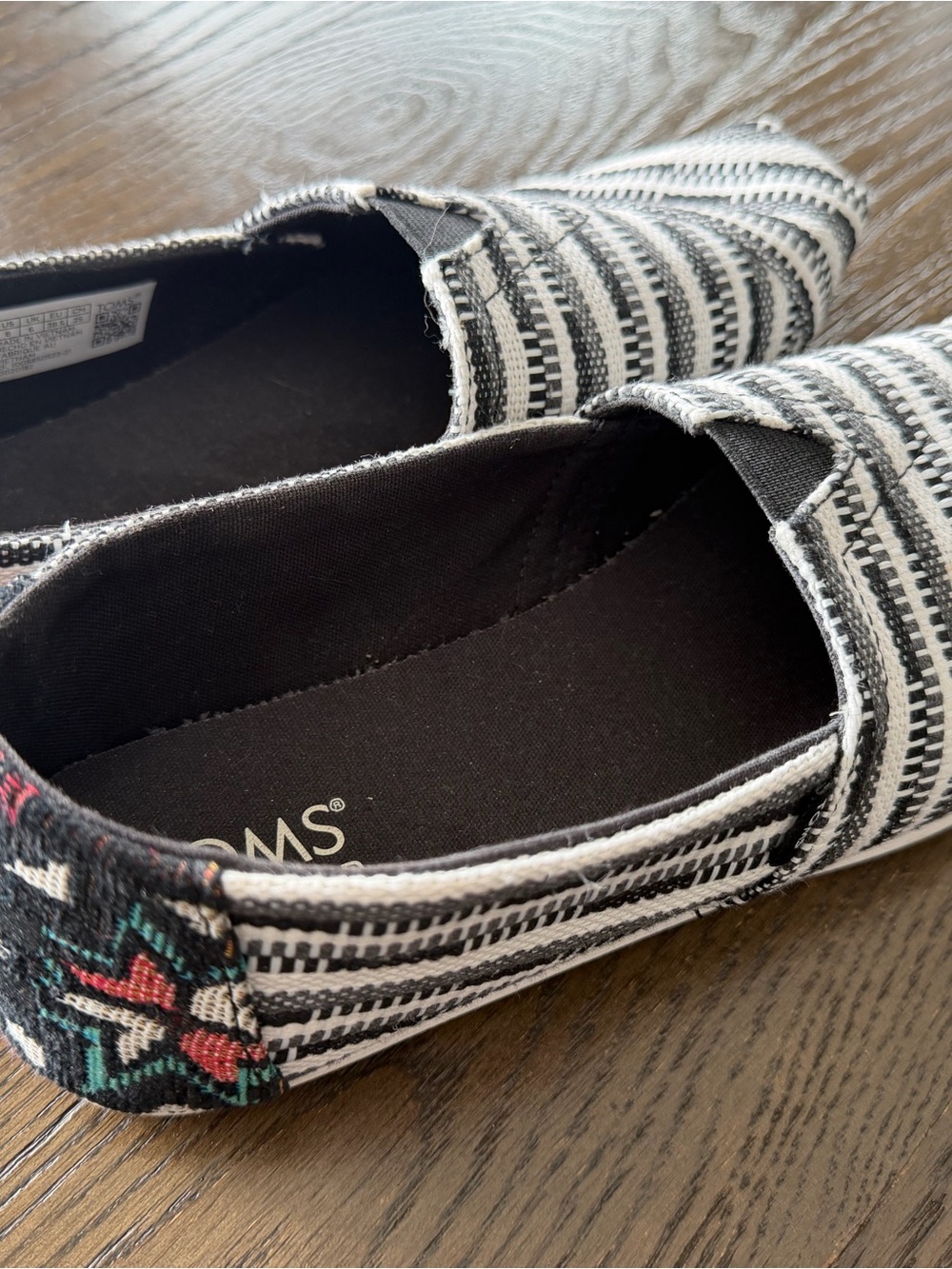 TOMS Black Slip-On Shoes with Multicolor Woven Trim